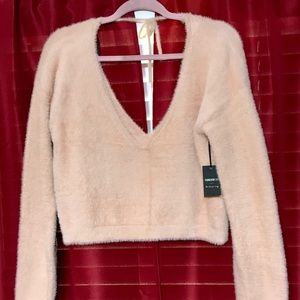 Fuzzy pink sweater, tie back